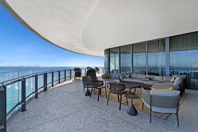 view of patio / terrace featuring a water view and an outdoor hangout area