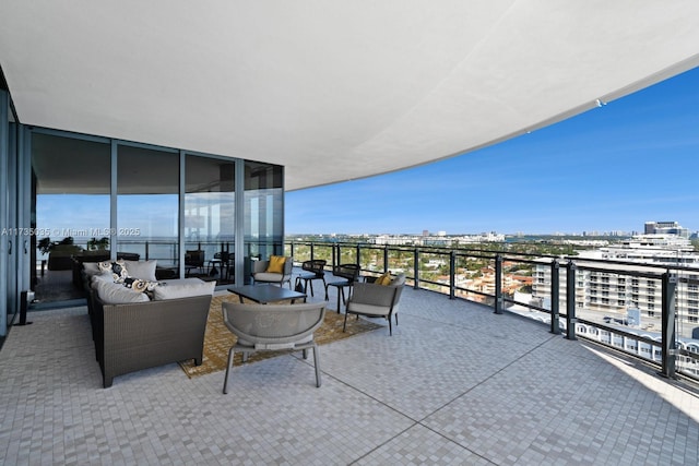 balcony featuring a view of city and outdoor lounge area