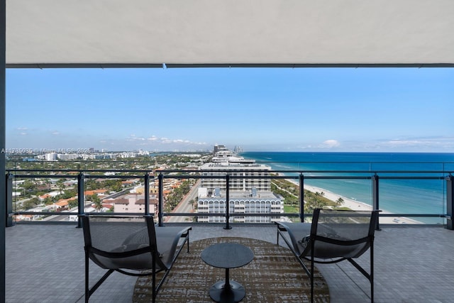 balcony with a water view and a city view