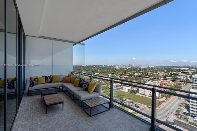 balcony with a city view and an outdoor hangout area