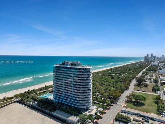 bird's eye view featuring a water view and a view of the beach