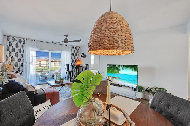 dining space featuring ceiling fan and wood finished floors