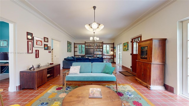 living room featuring ornamental molding, tile patterned floors, and an inviting chandelier