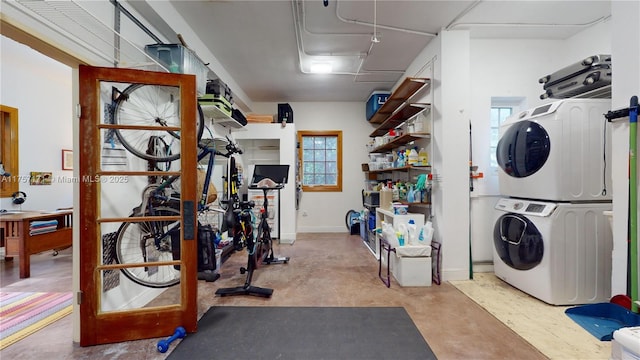 interior space featuring stacked washer / dryer