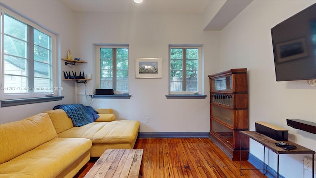 interior space featuring baseboards and wood finished floors