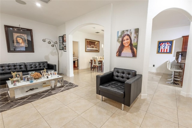 15333 SW 184th St, Miami, FL 33187 - living room featuring light tile patterned floors, baseboards, and arched walkways