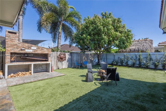 15333 SW 184th St, Miami, FL 33187 - view of yard with a patio area, an outdoor fire pit, and a fenced backyard