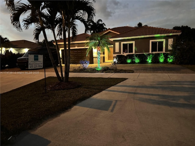 15333 SW 184th St, Miami, FL 33187 - view of front facade with a garage, stucco siding, driveway, and a tiled roof