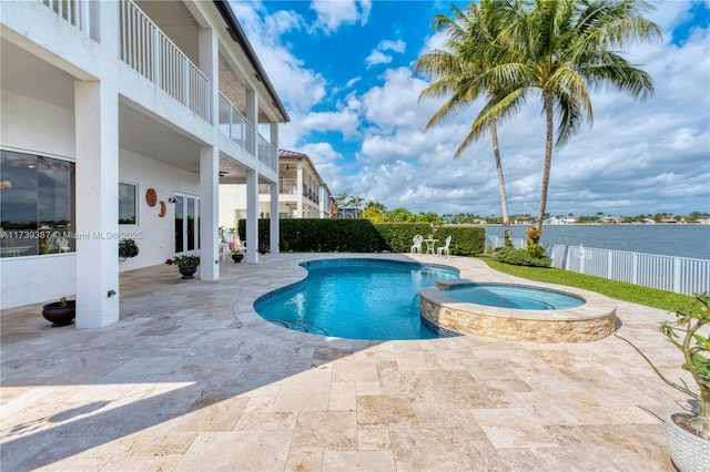 view of pool featuring a patio, fence, a pool with connected hot tub, and ceiling fan