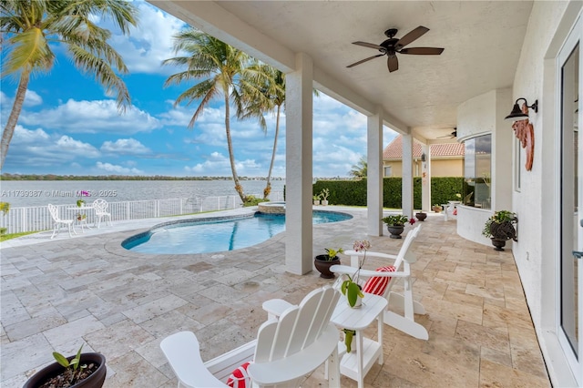 19239 SW 54th St, Miramar, FL 33029 - view of pool featuring a ceiling fan, a water view, a patio area, a fenced backyard, and a pool with connected hot tub