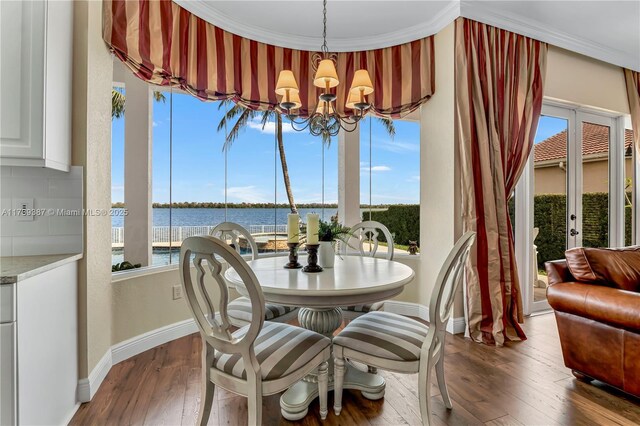 19239 SW 54th St, Miramar, FL 33029 - dining space with baseboards, a chandelier, dark wood finished floors, and healthy amount of natural light
