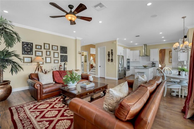 19239 SW 54th St, Miramar, FL 33029 - living room with a ceiling fan, recessed lighting, crown molding, arched walkways, and baseboards