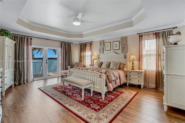 19239 SW 54th St, Miramar, FL 33029 - bedroom featuring a tray ceiling, access to outside, ornamental molding, light wood-style floors, and a ceiling fan
