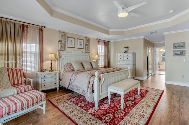 19239 SW 54th St, Miramar, FL 33029 - bedroom featuring a tray ceiling, hardwood / wood-style flooring, ornamental molding, baseboards, and a ceiling fan