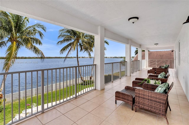 balcony featuring a water view