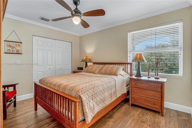 19239 SW 54th St, Miramar, FL 33029 - bedroom featuring baseboards, a closet, light wood finished floors, ornamental molding, and a ceiling fan
