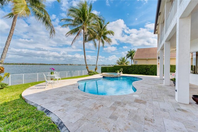 19239 SW 54th St, Miramar, FL 33029 - view of pool featuring a water view, a patio, and a pool with connected hot tub