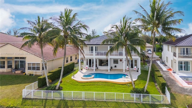 19239 SW 54th St, Miramar, FL 33029 - rear view of property with a balcony, a pool with connected hot tub, stucco siding, and a patio
