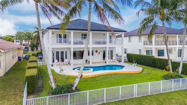 19239 SW 54th St, Miramar, FL 33029 - back of property with a balcony, stucco siding, a patio area, and a pool with connected hot tub