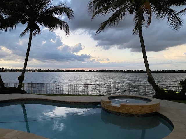 19239 SW 54th St, Miramar, FL 33029 - view of pool featuring a pool with connected hot tub and a water view