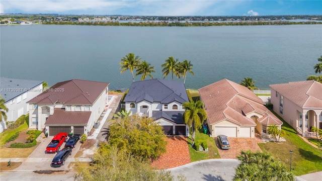 bird's eye view with a residential view and a water view