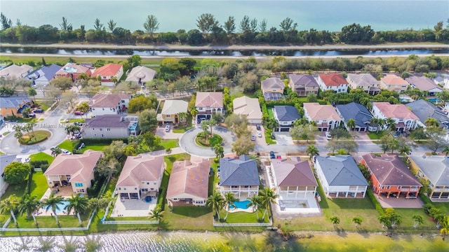 bird's eye view with a residential view and a water view