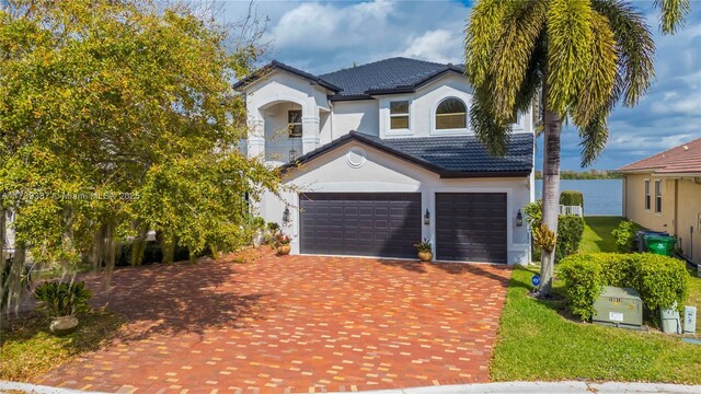 19239 SW 54th St, Miramar, FL 33029 - view of front of home with decorative driveway, a tile roof, stucco siding, and a garage