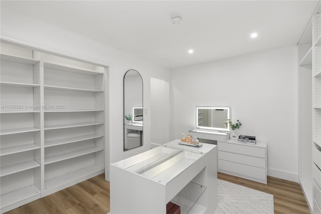 interior space with recessed lighting, light wood-style flooring, and baseboards