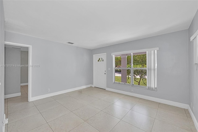 5248 N Andrews Ave, Oakland Park, FL 33309 - spare room with light tile patterned floors, baseboards, and visible vents