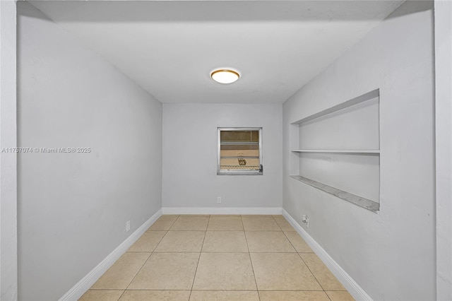 5248 N Andrews Ave, Oakland Park, FL 33309 - empty room featuring light tile patterned floors and baseboards