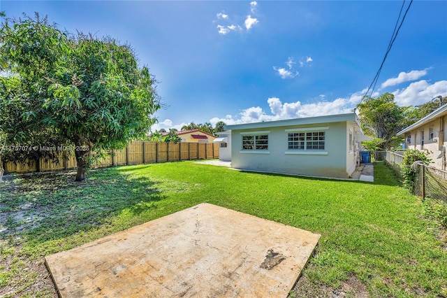 view of yard featuring a fenced backyard and a patio