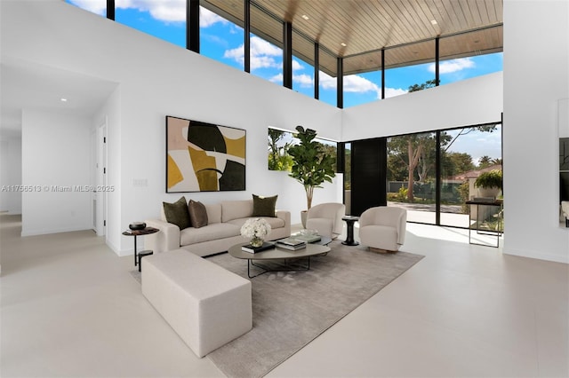 6991 SW 91st St, Pinecrest, FL 33156 - living area featuring a high ceiling, concrete flooring, and recessed lighting