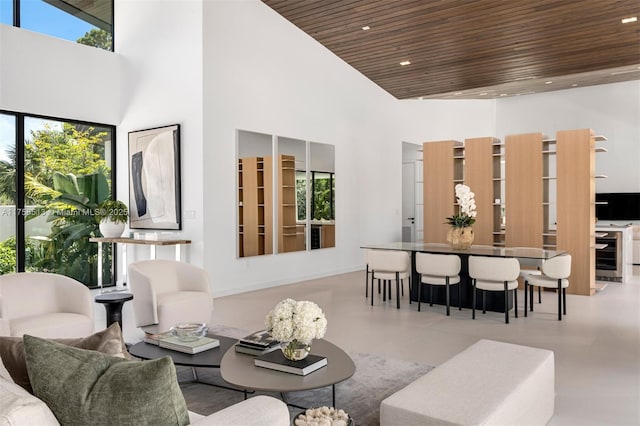 6991 SW 91st St, Pinecrest, FL 33156 - living room featuring a towering ceiling, wooden ceiling, wine cooler, and recessed lighting