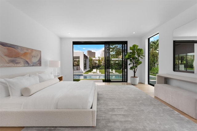 6991 SW 91st St, Pinecrest, FL 33156 - bedroom with access to outside, wood finished floors, and recessed lighting