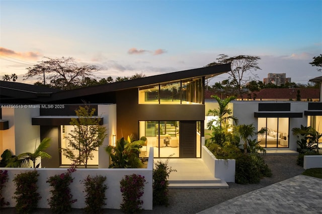 6991 SW 91st St, Pinecrest, FL 33156 - contemporary house featuring stucco siding and a fenced front yard
