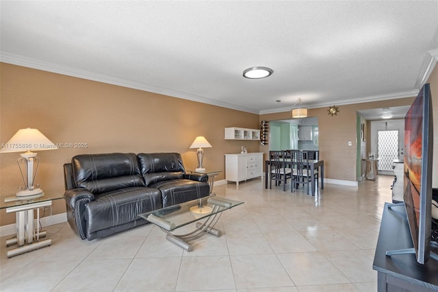 living room featuring light tile patterned floors, ornamental molding, a textured ceiling, and baseboards