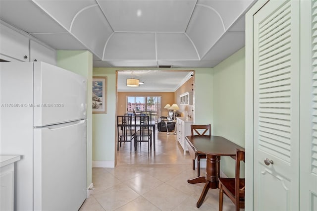 dining space with light tile patterned floors