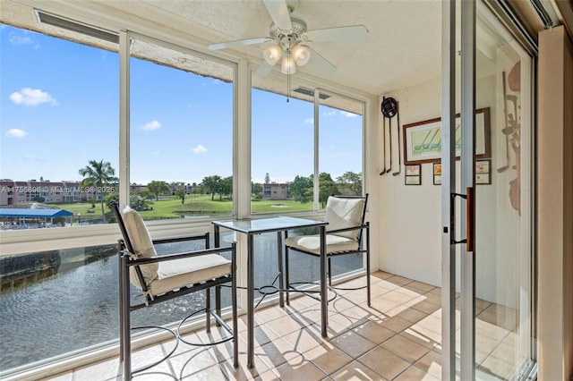 sunroom with a ceiling fan