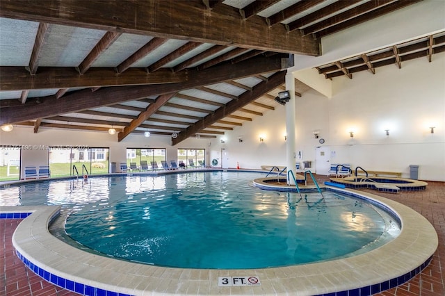 community pool with an indoor in ground hot tub