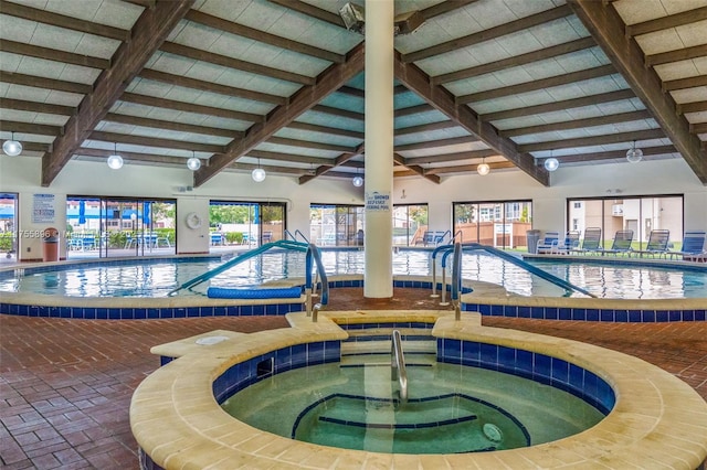 community pool featuring an indoor hot tub