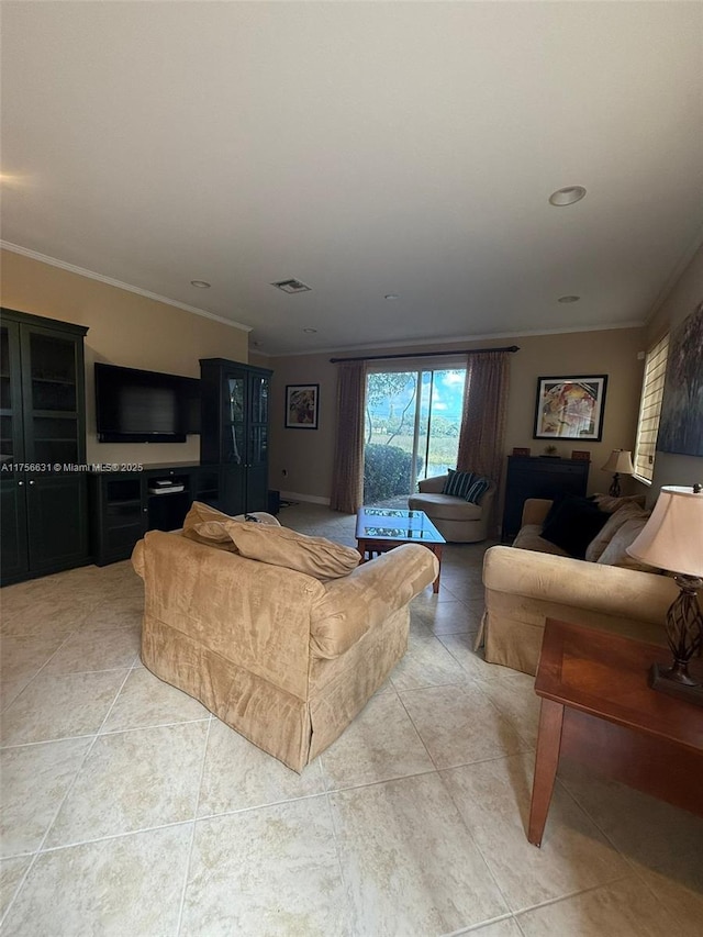 living area featuring light tile patterned floors, ornamental molding, and visible vents