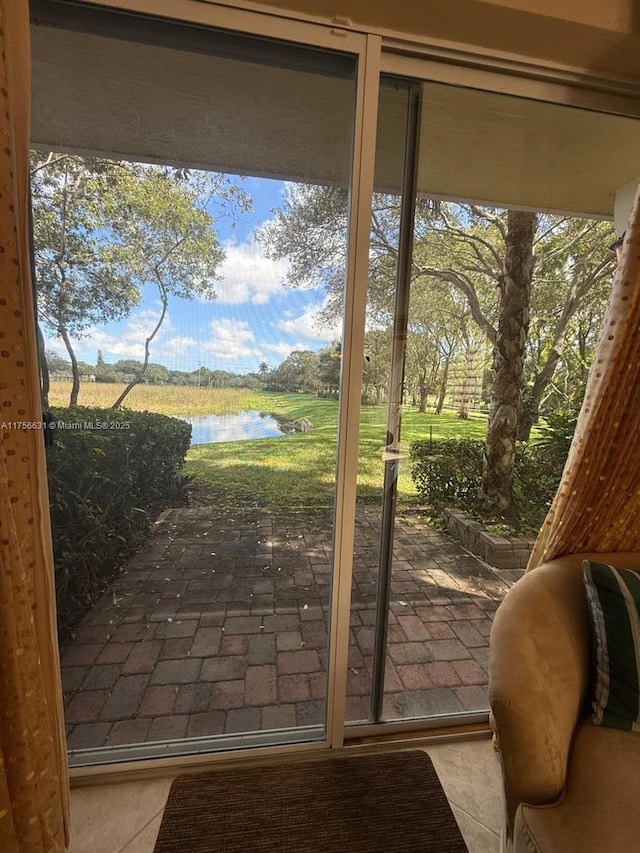 doorway to outside featuring a water view