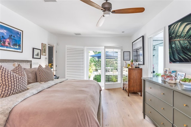 bedroom featuring visible vents, light wood-style flooring, and ceiling fan