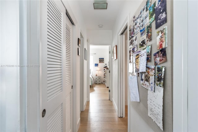 corridor with light wood finished floors