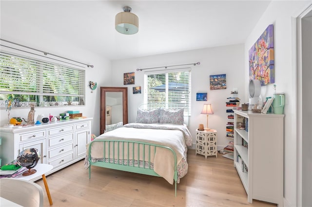 bedroom featuring light wood finished floors