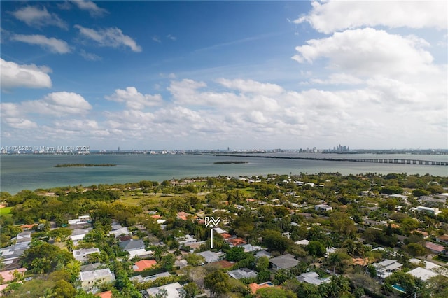 drone / aerial view featuring a residential view and a water view
