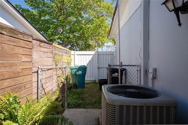 exterior space with central air condition unit and fence