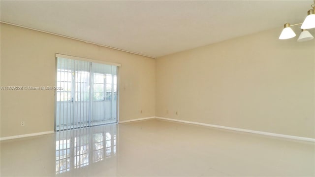 empty room featuring baseboards