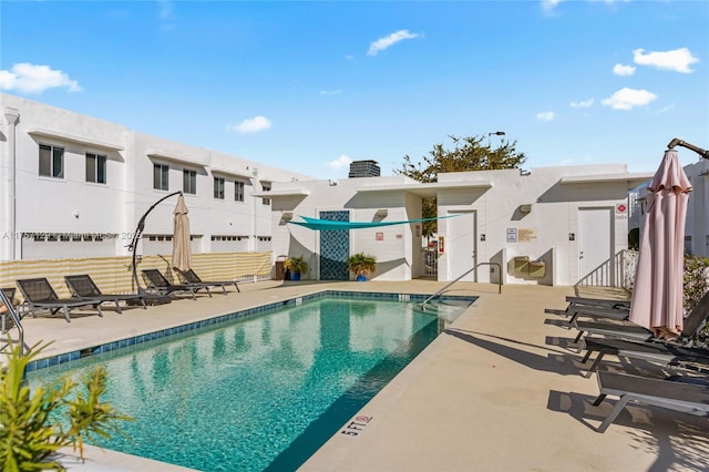 pool with a patio area