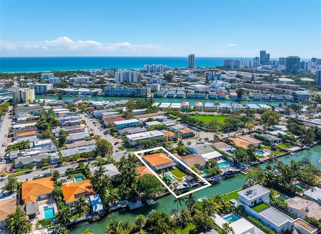 drone / aerial view featuring a water view and a city view